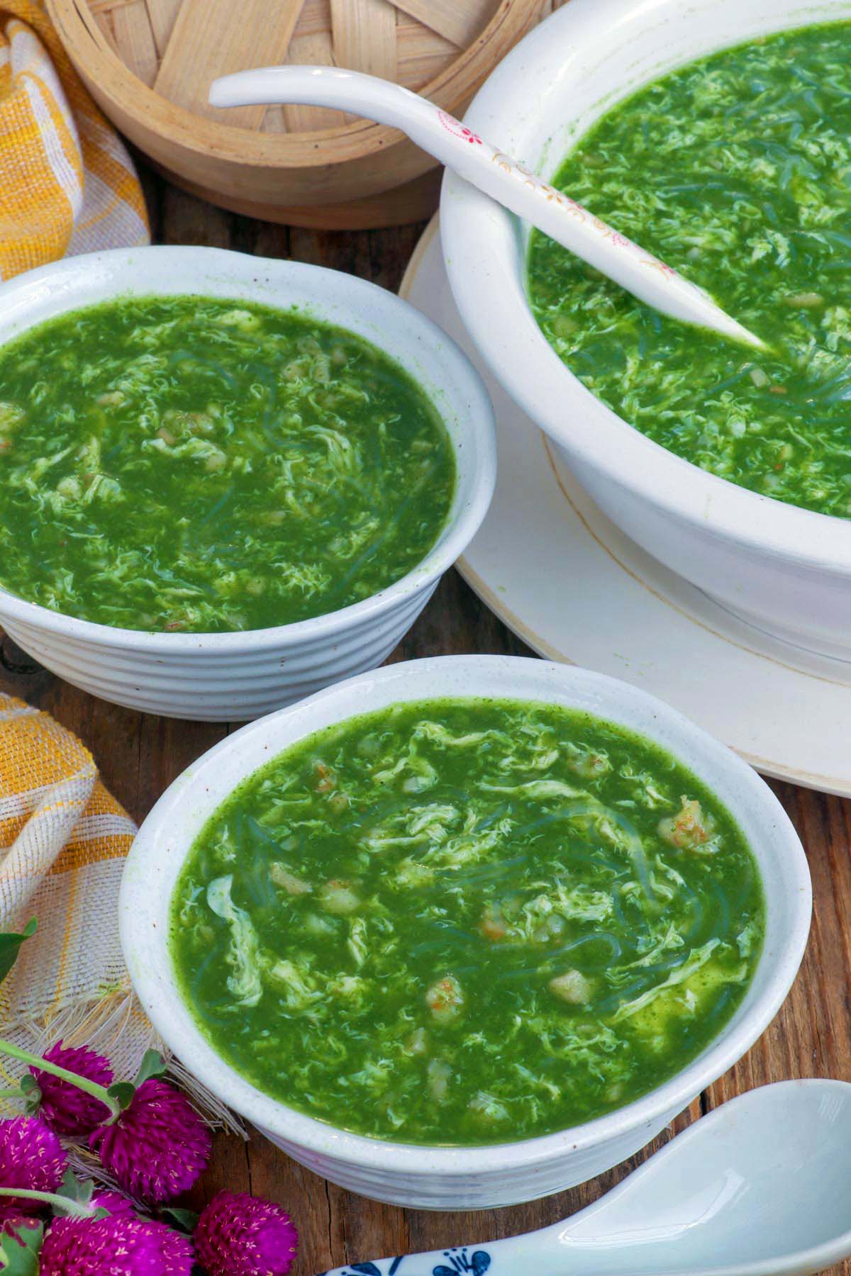 Bowls full of green soup, Chinese spinach soup.