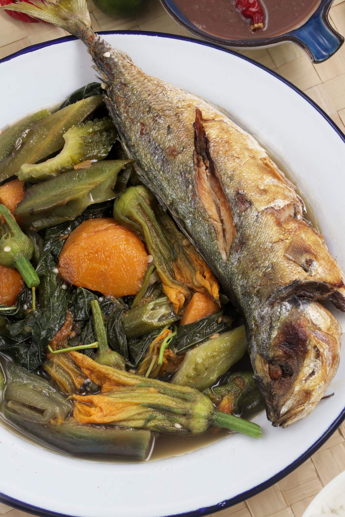 Dinengdeng with fried fish on a serving plate.