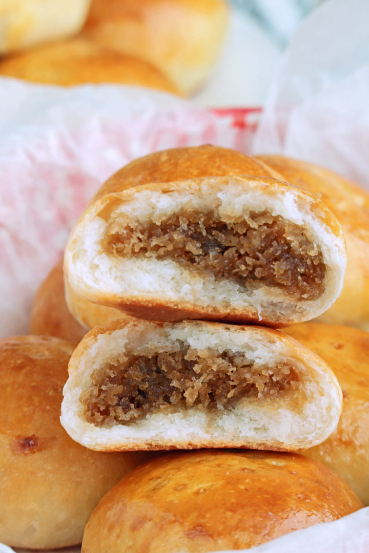 Pan de Coco are Filipino sweet buns stuffed with sweet grated coconut.
