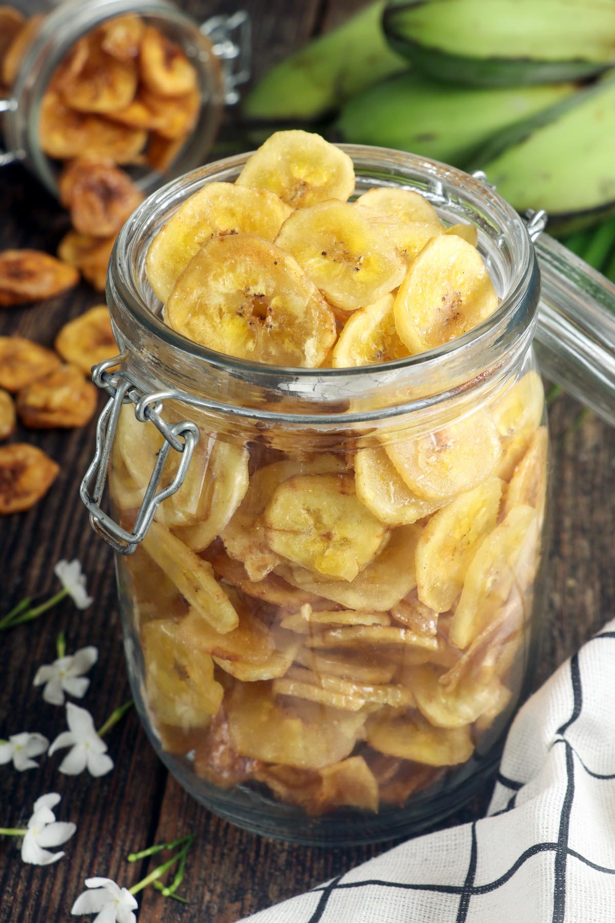 Homemade banana chips in a jar.