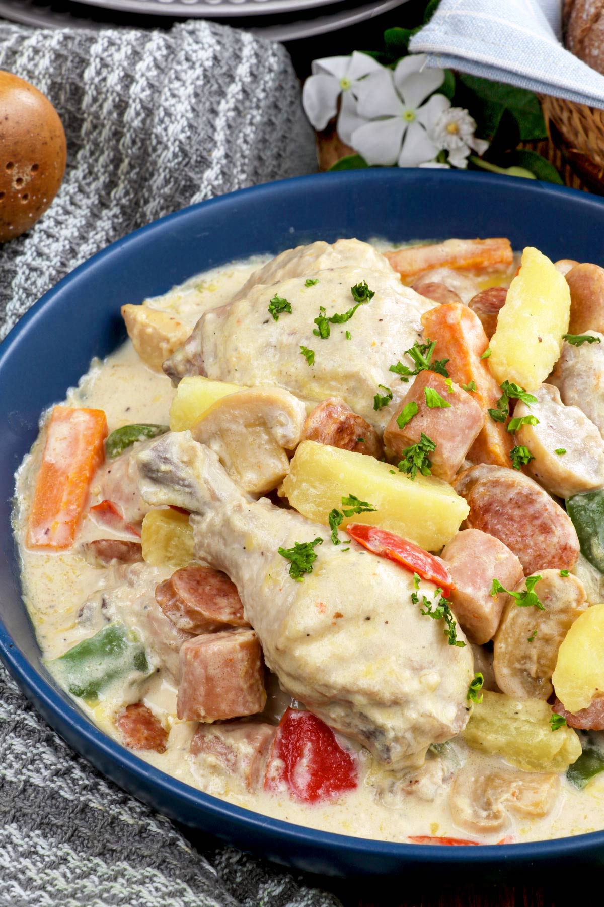 Filipino chicken pastel with chorizo de bilbao, sausages, and vegetables in a creamy white sauce..