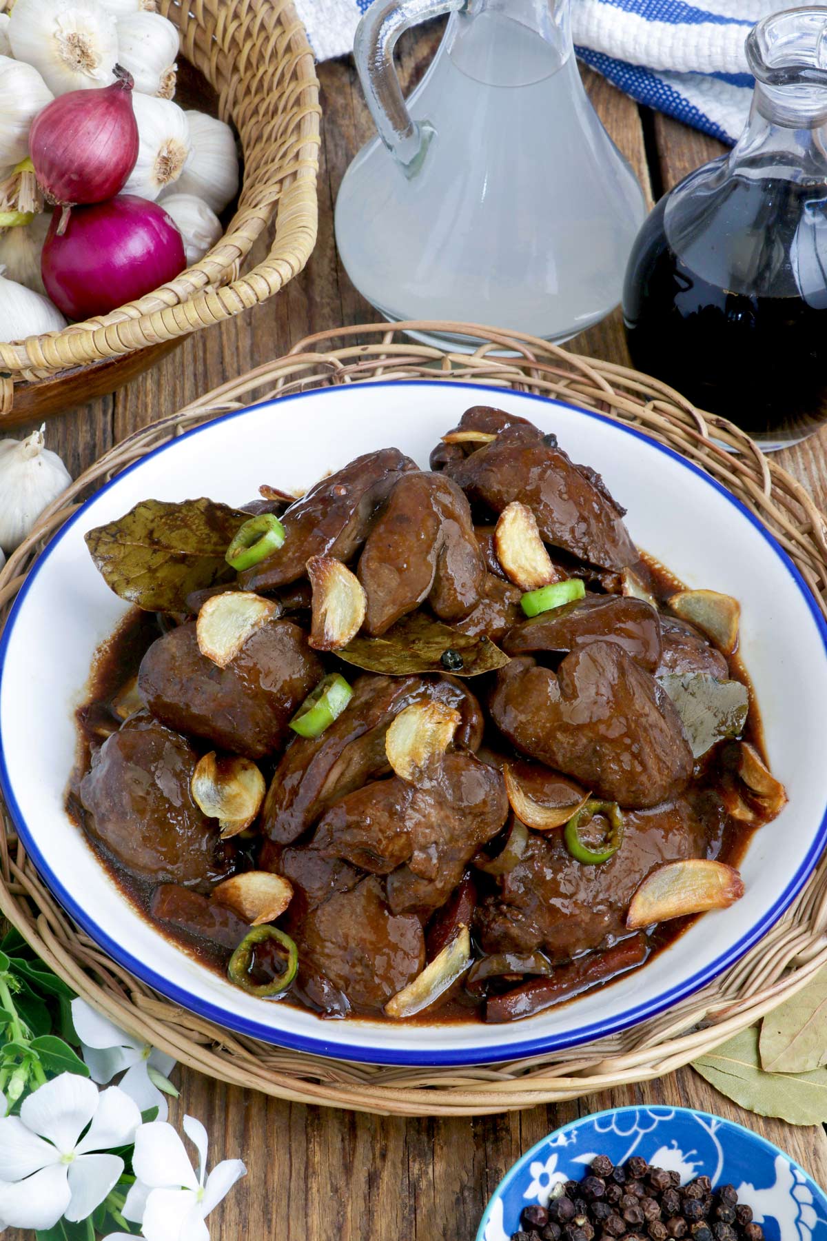 Adobong Atay ng Manok in a serving platter garnished with fried garlic slivers.