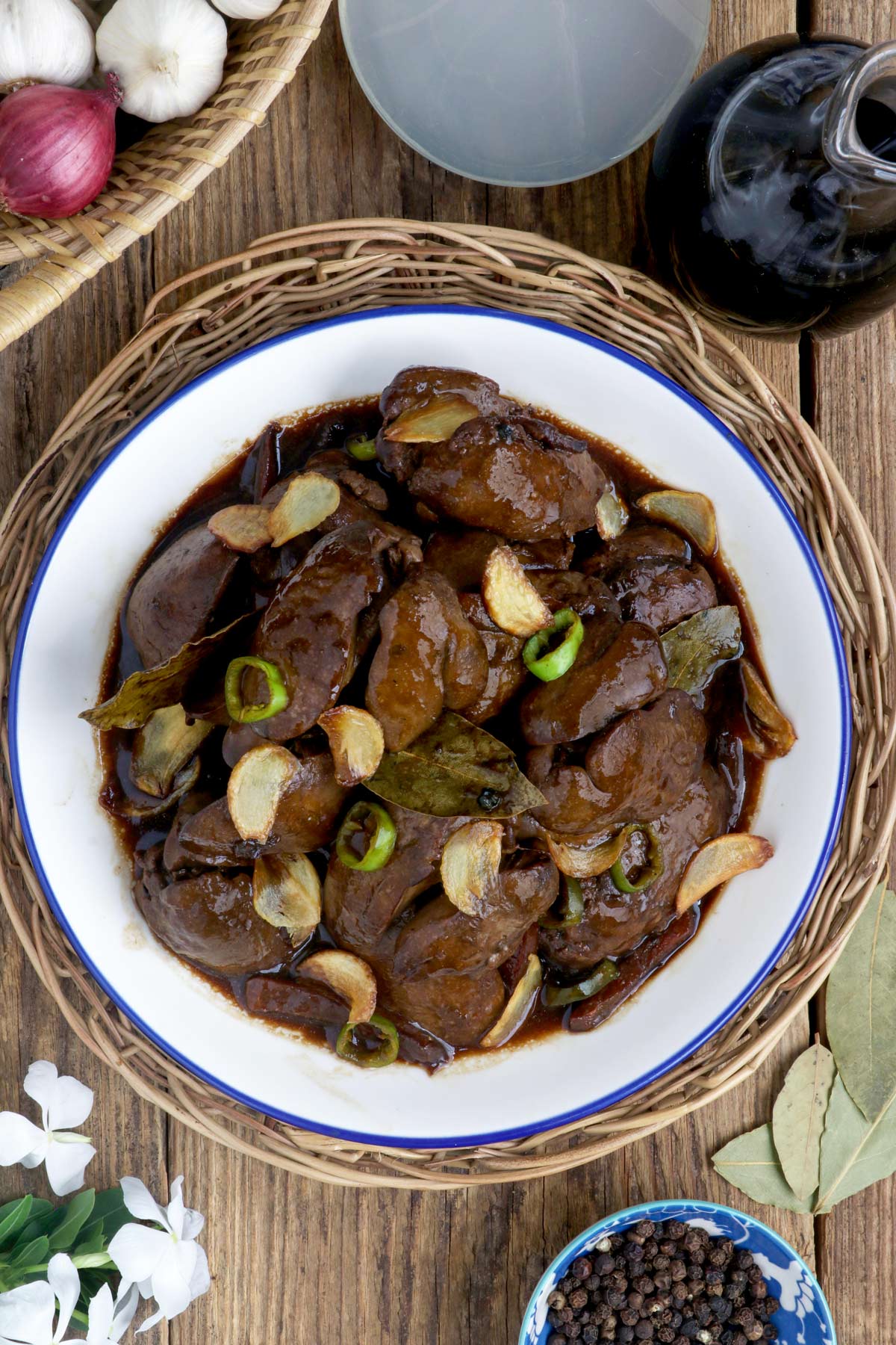 Adobong Atay ng Manok in a serving platter garnished with fried garlic slivers.