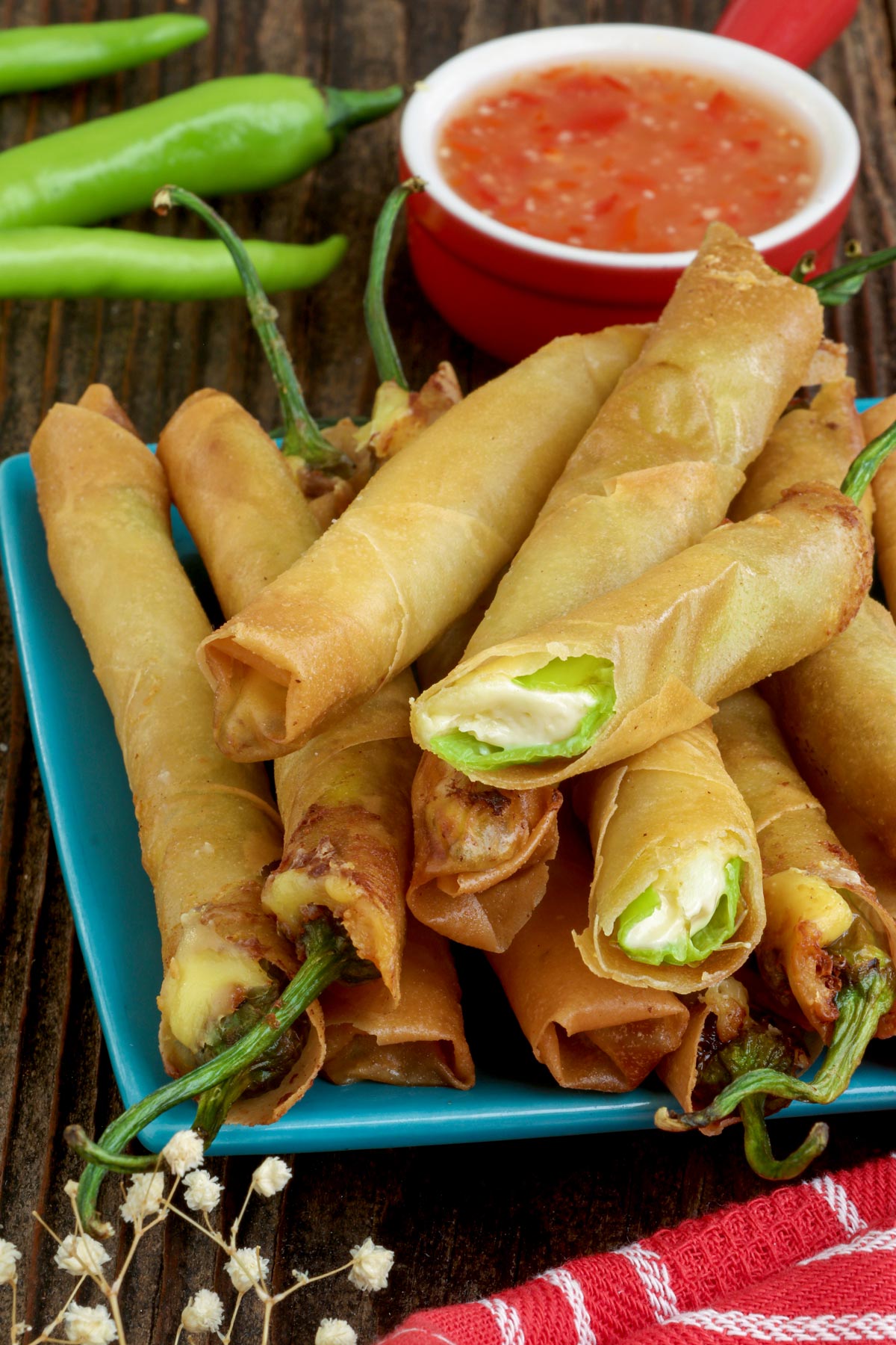 Cheesy and crunchy Dynamite Lumpia with sweet and sour sauce on the side.