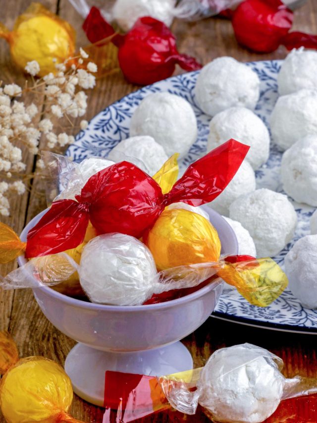 Macapuno Balls made from macapuno preserves and condensed milk wrapped in colorful cellophane plastics.