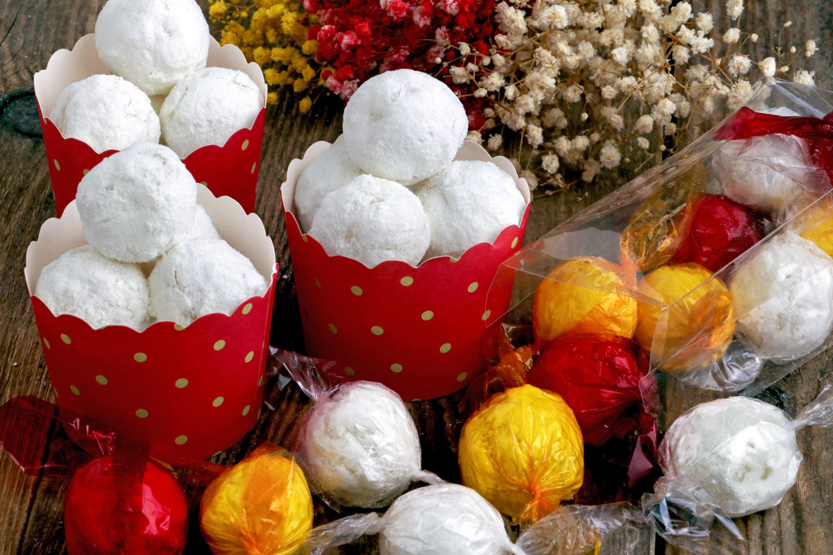 Macapuno Balls made from macapuno preserves and condensed milk wrapped in colorful cellophane.