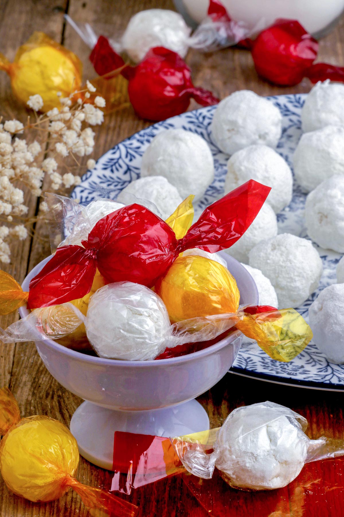 Macapuno Balls made from macapuno preserves and condensed milk wrapped in colorful cellophane plastics.