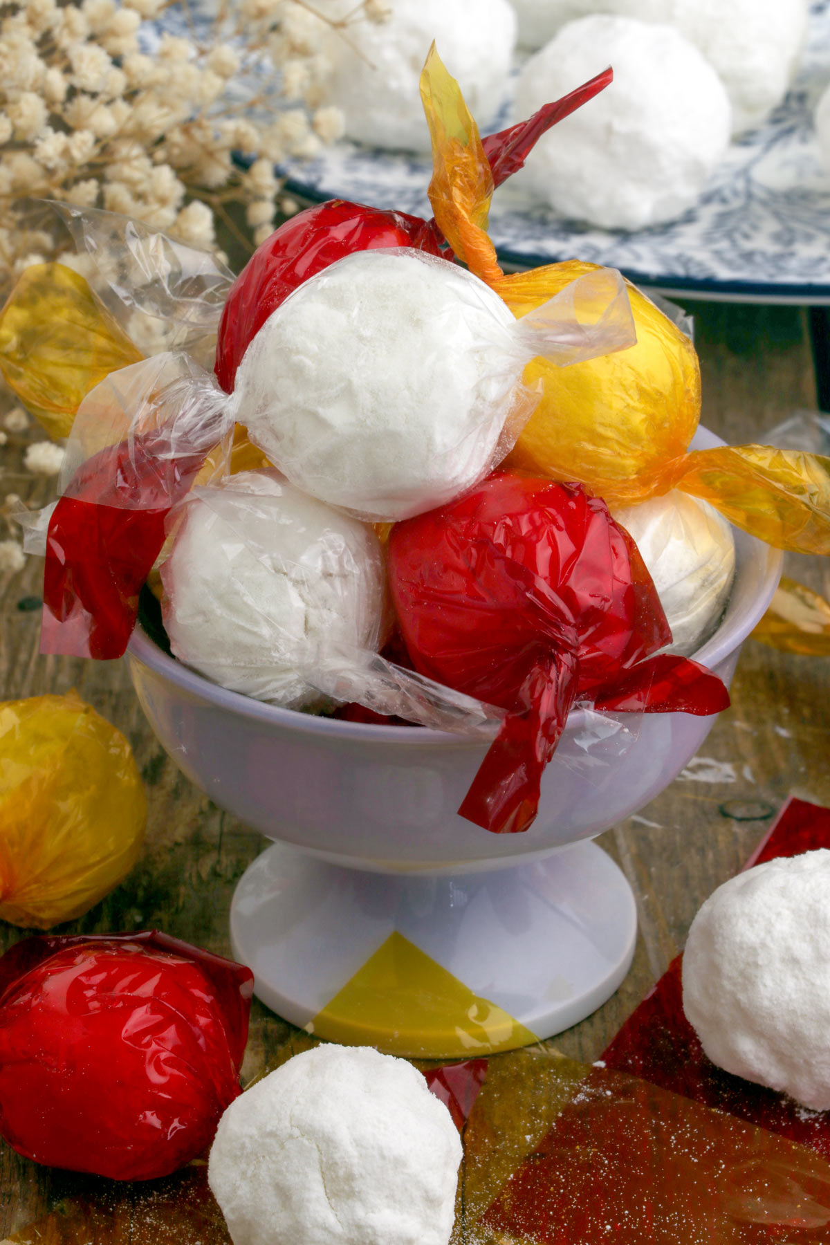 Macapuno Balls made from macapuno preserves and condensed milk wrapped in colorful cellophane plastics.