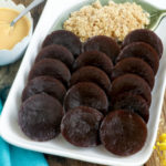 Black Kutsinta served with desiccated coconut and dulce de leche.