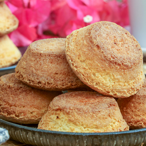 Sweet and crunchy Mamon Tostado stacked on a serving plate.