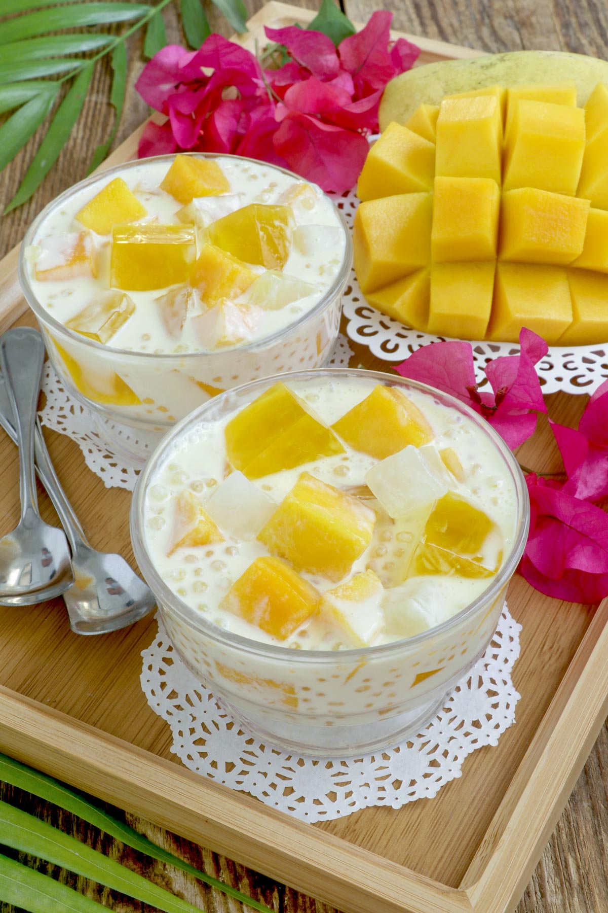 Creamy Mango Jelly with juicy and sweet mango cubes, mango-flavored jelly, nata de coco and mini tapioca pearls.