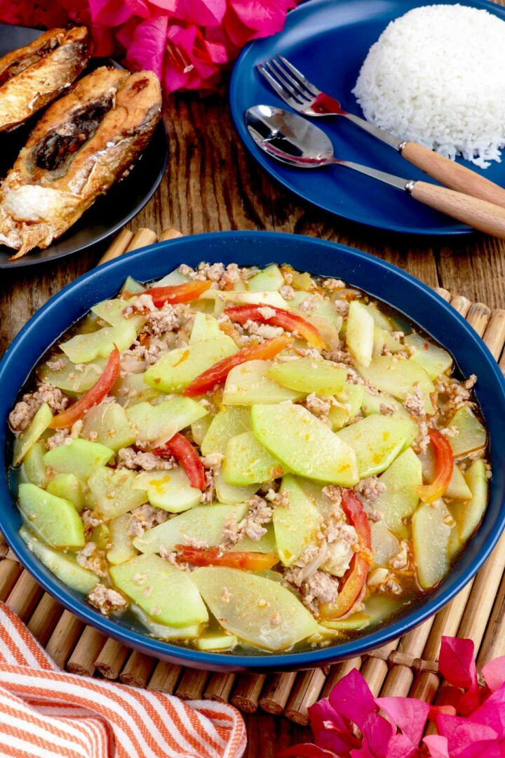 Ginisang sayote with tender chayote slices, tomatoes, and ground pork.