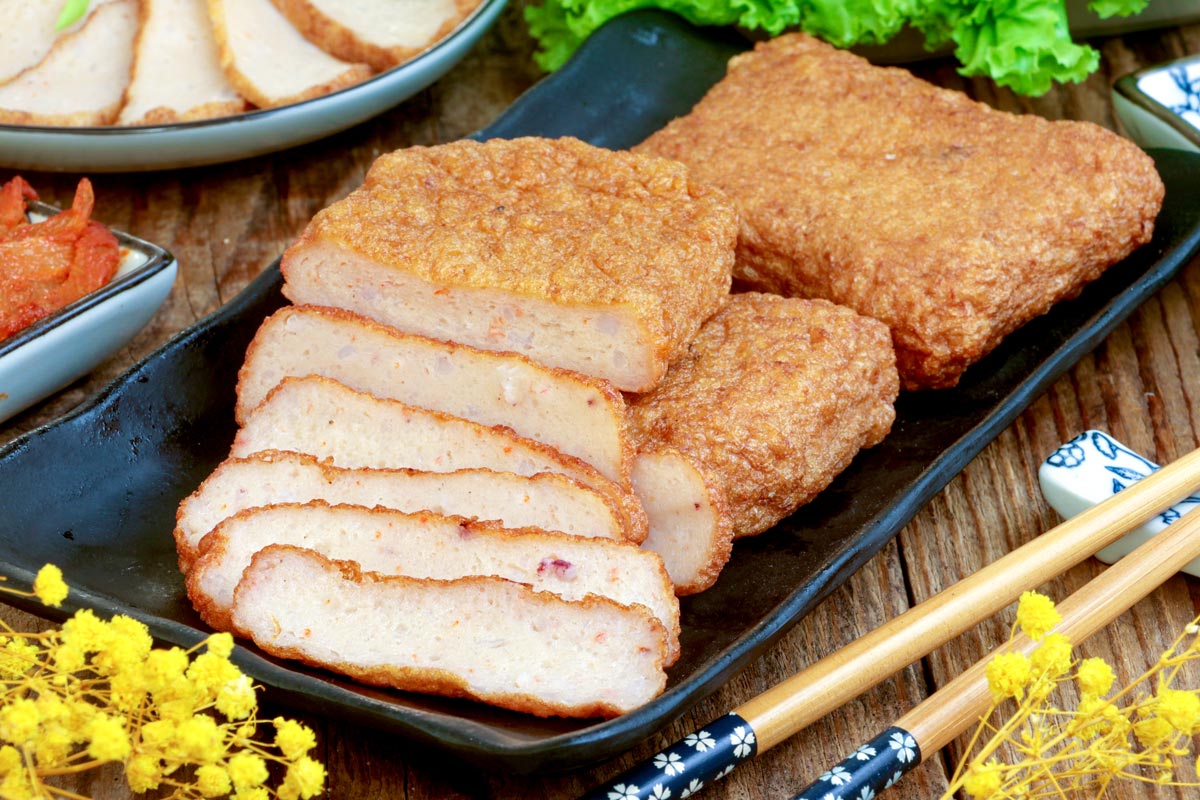 Freshly cooked Homemade Korean Fish Cake on a serving plate served with dipping sauce.