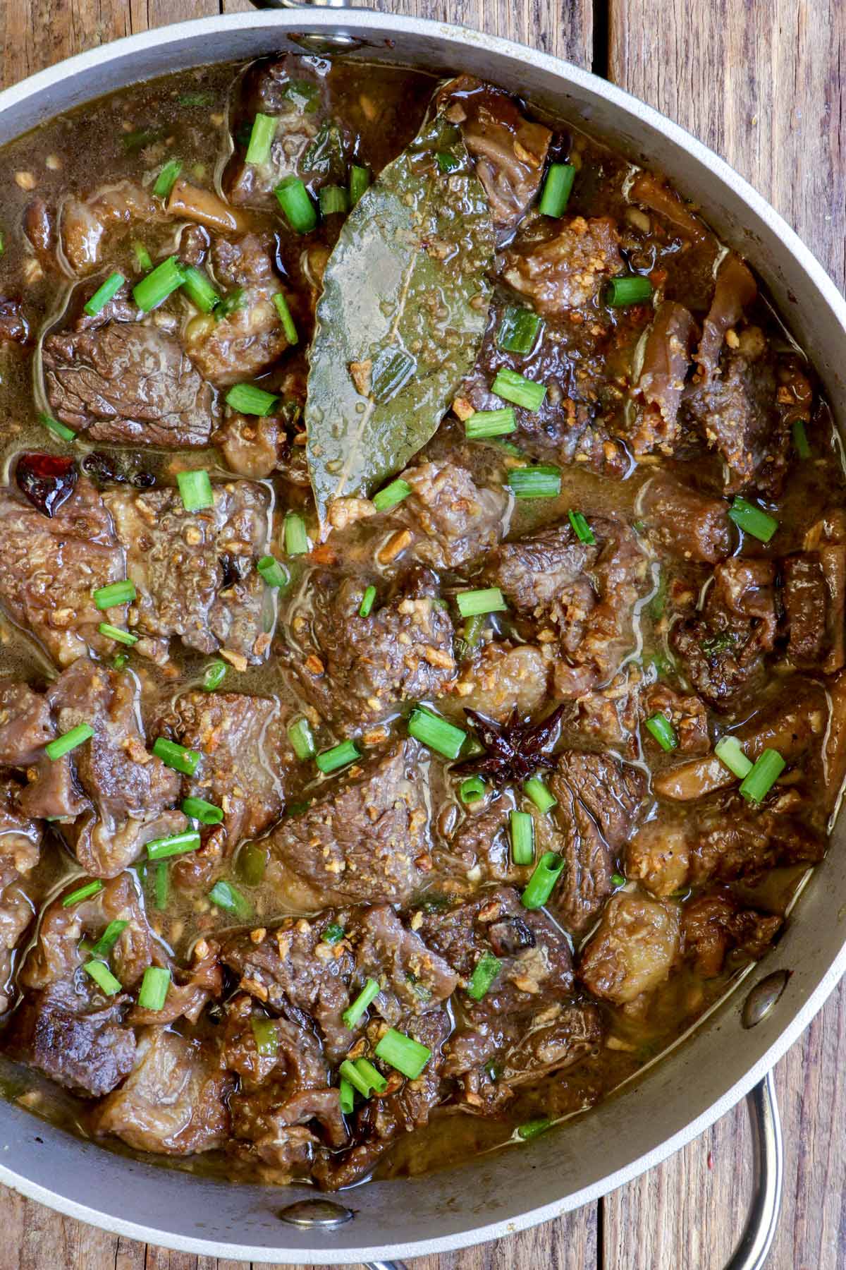 Freshly cooked beef pares in a pan.