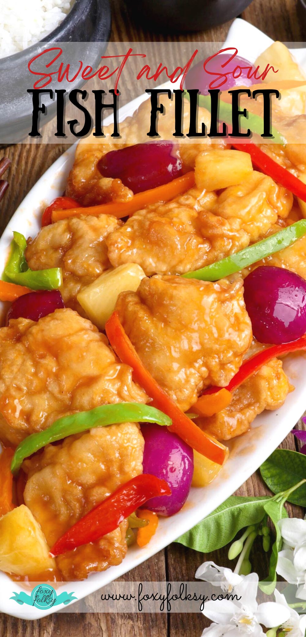 Sweet and Sour Fish with colorful bell pepper strips and pineapple chunks on a serving platter.