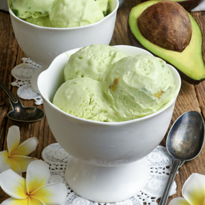 Scoops of avocado ice cream on a dessert bowl.
