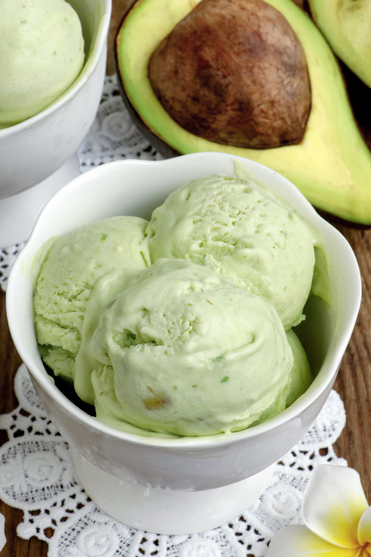 Scoops of avocado ice cream on a dessert bowl.