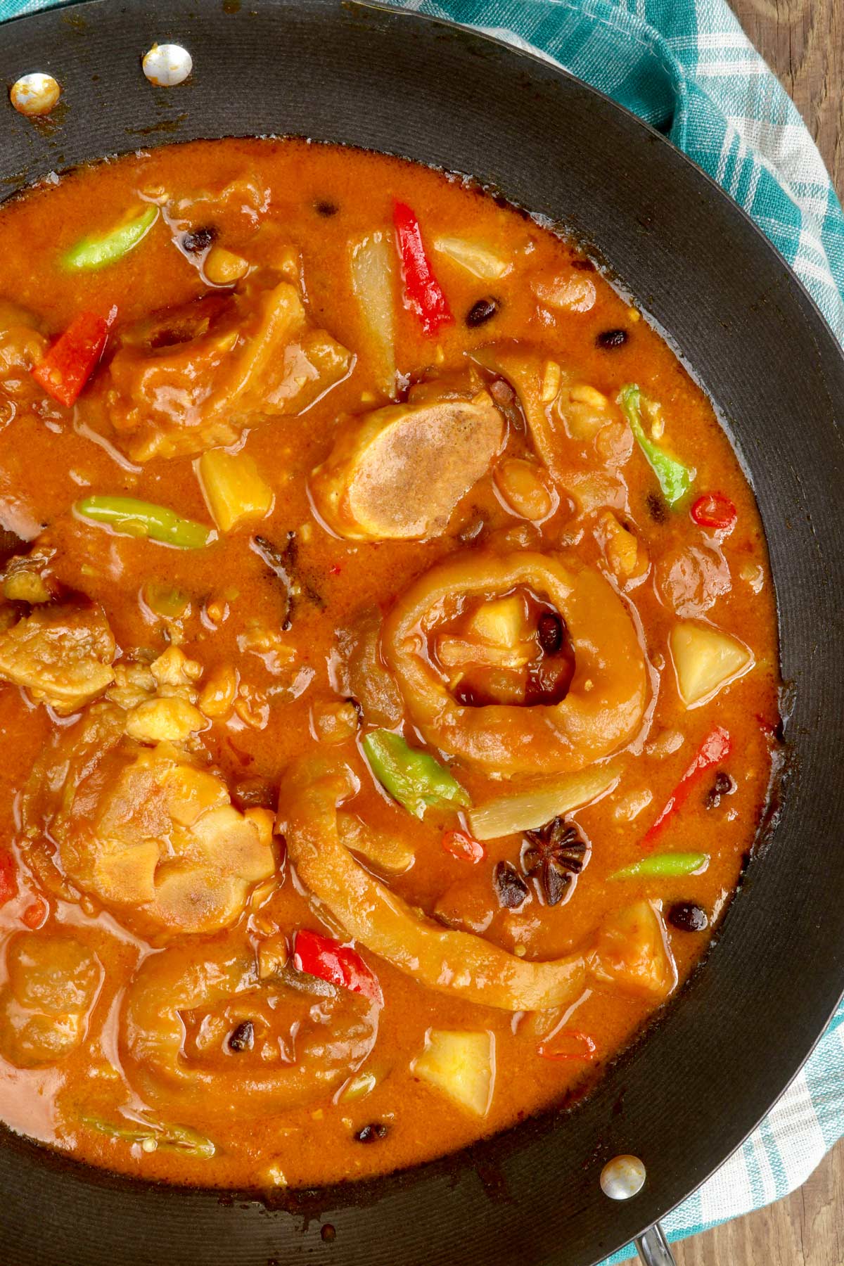 njoy this tenderized ox feet with pineapple chunks, pork and beans and bell pepper simmered in a hearty stew flavored with annatto, star anise, and peanut butter.