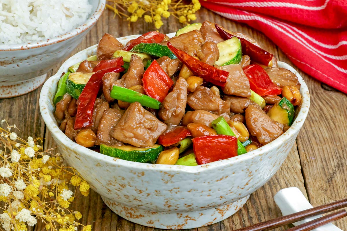Kung Pao Chicken with tender and juicy chicken in velvety sweet, salty, and spicy sauce.