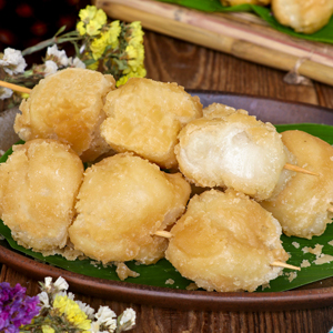 Carioca are Filipino Fried Rice Balls coated with sugar usually sold on skewers.