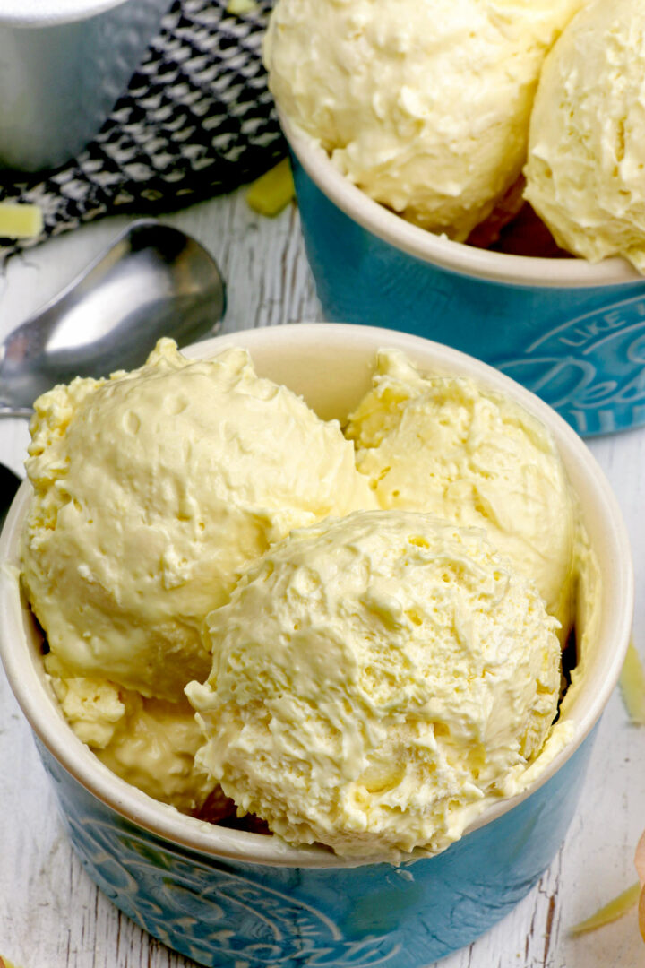 Scoops of sweet and salty homemade Cheese ice cream in dessert bowls.