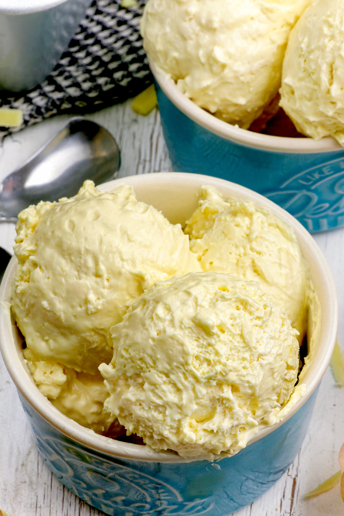 Scoops of sweet and salty homemade Cheese ice cream in dessert bowls.