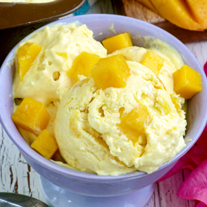 Homemade mango ice cream with real mango chunks.