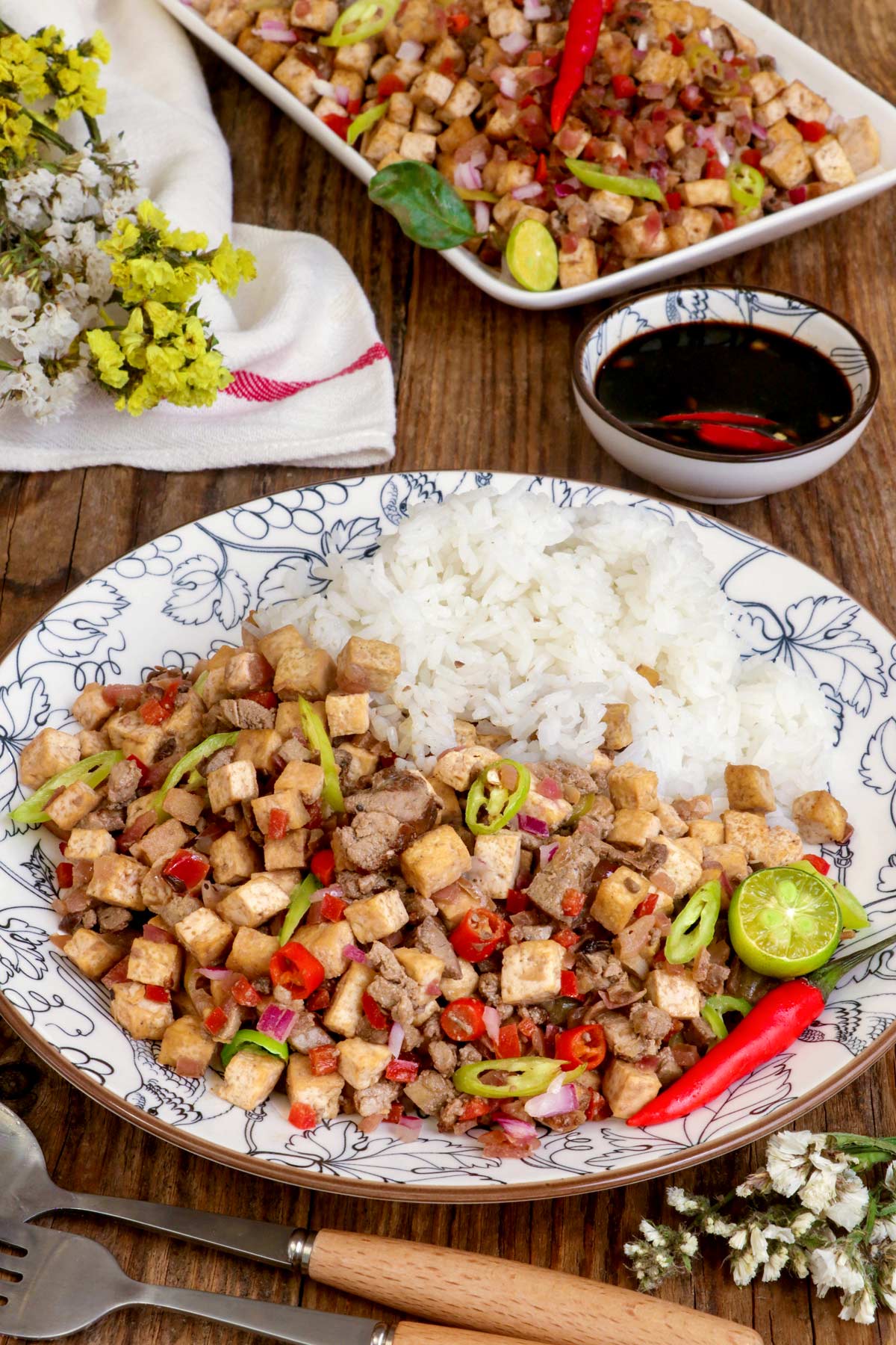 Tofu Sisig on a plate served with rice.
