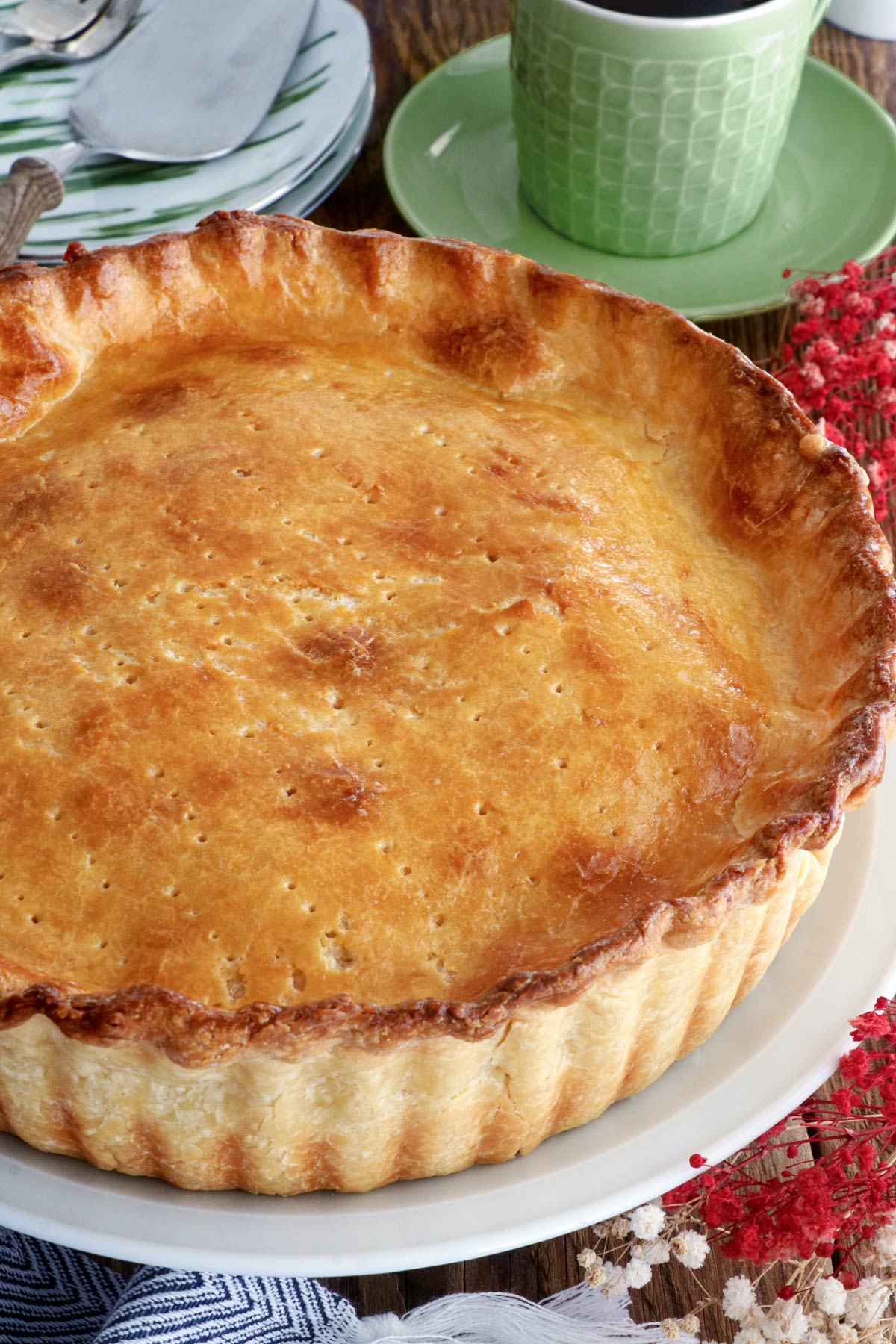 Whole buko pie with a golden flaky crust.