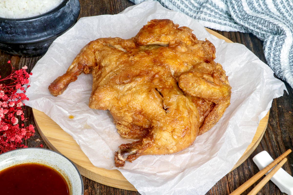 Crispy Whole Fried Chicken on a serving platter.