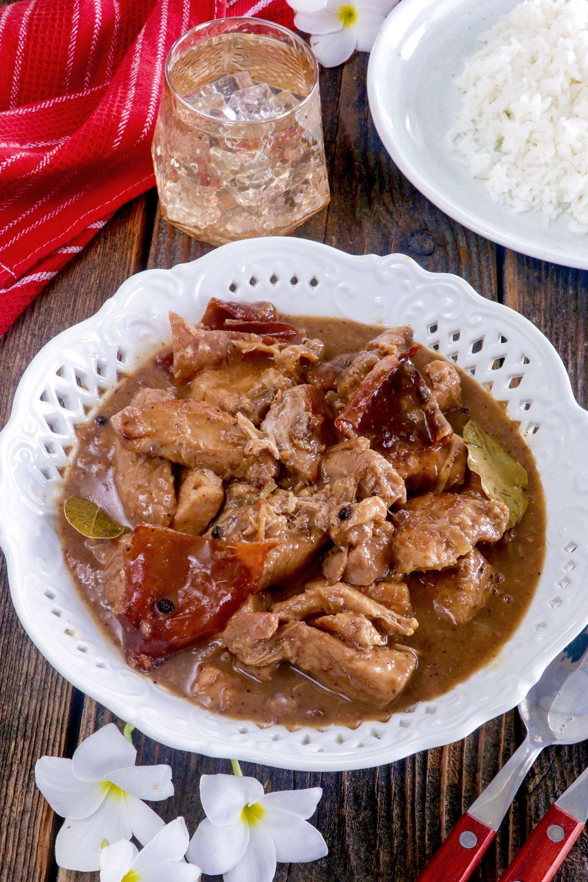 Lechon Paksiw in a serving platter served with steamed rice.