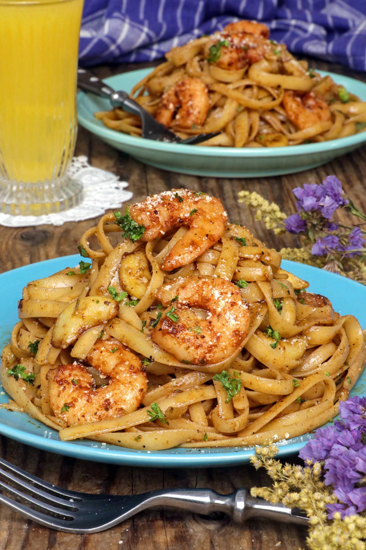 Cajun shrimp pasta on serving plates.