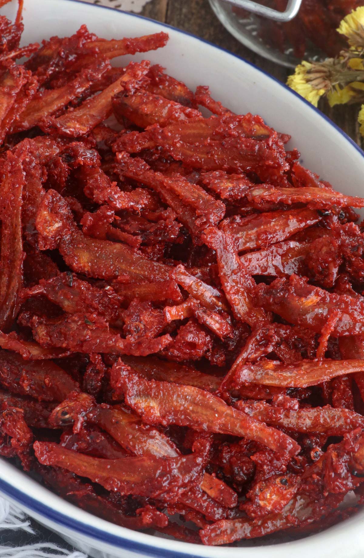 Crisp and crunchy sweet and spicy dilis in a serving plate.