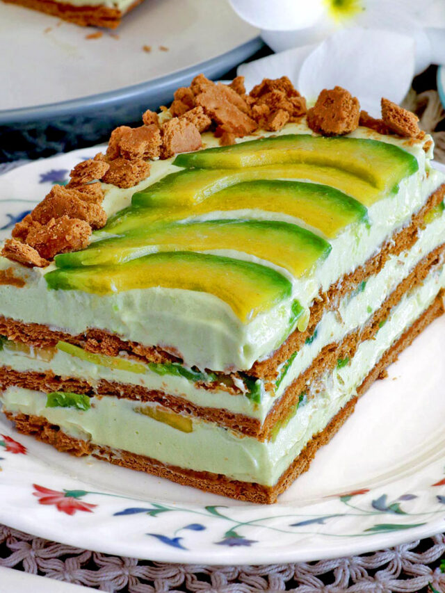 A slice of avocado float topped with slices of avocado and crushed graham crackers.