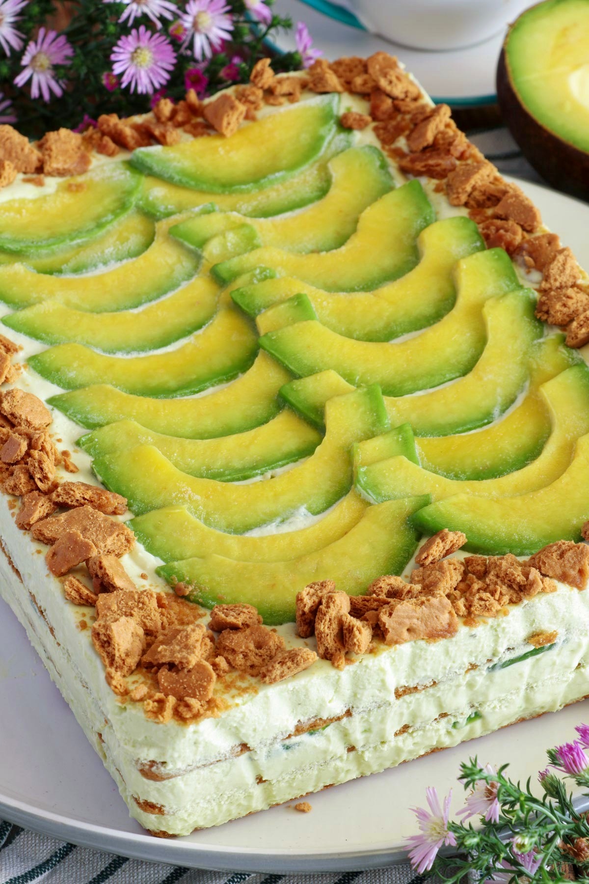 Avocado graham float topped with slices of avocado and crushed graham crackers.