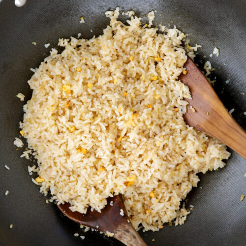 Sinangag or the Filipino fried rice loaded with garlic cooked in a wok.