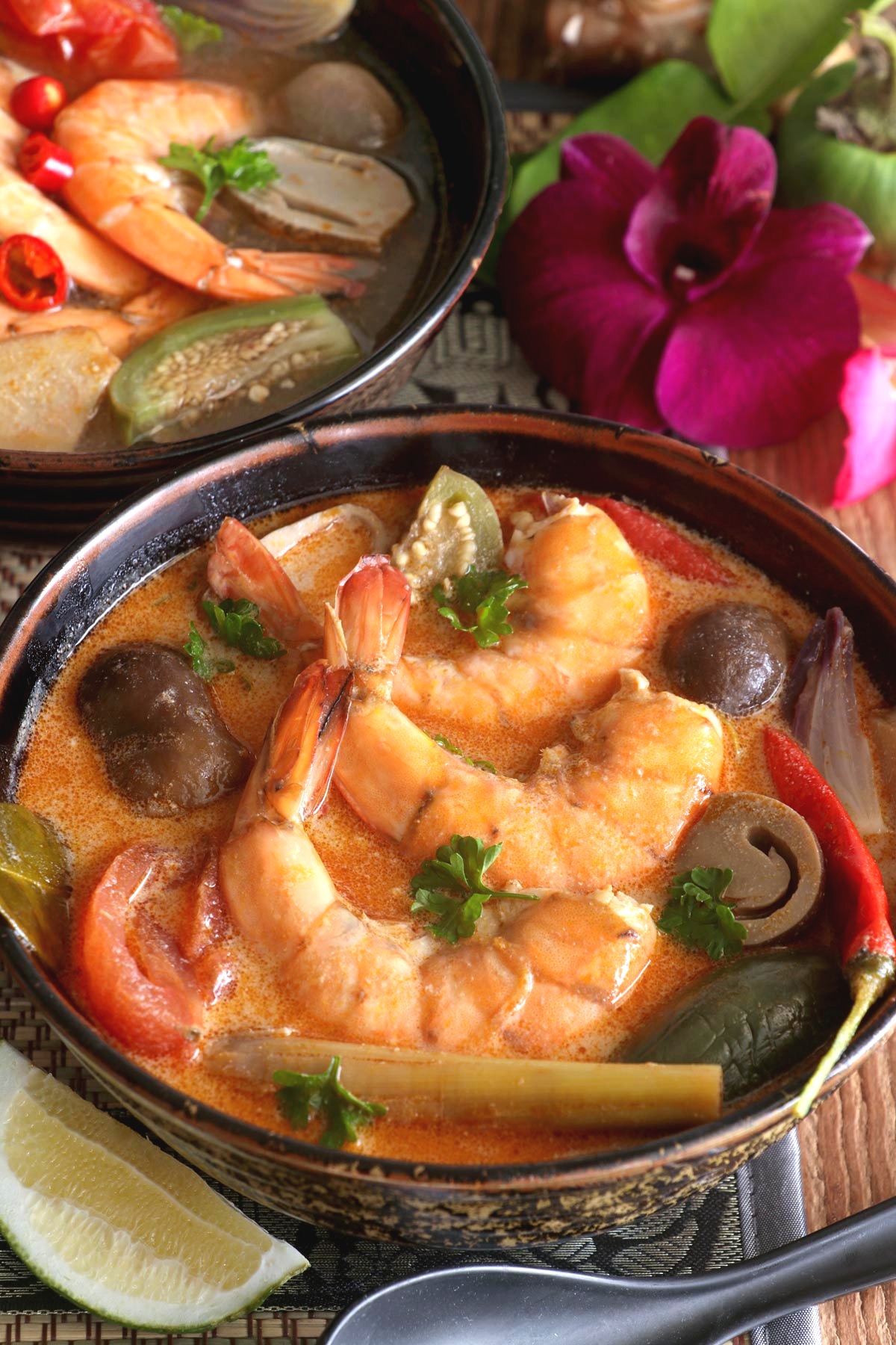 Tom yum goong in serving bowls.