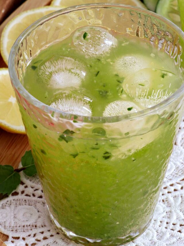 A glass of cucumber juice served over ice.