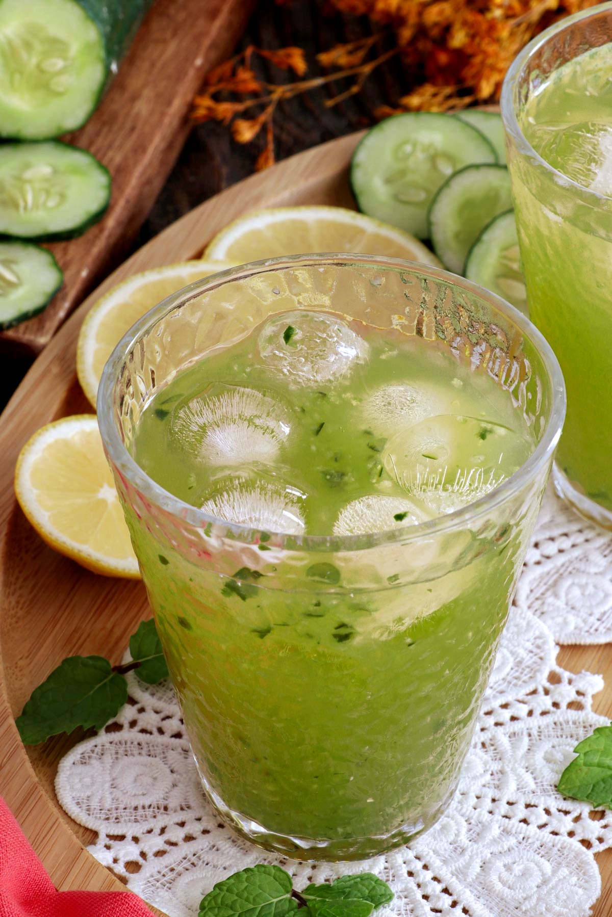 A glass of cucumber juice served over ice.